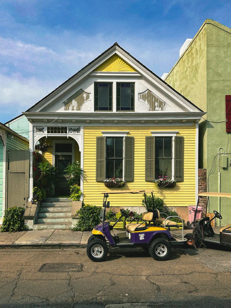 Yellow raised home in a New Orleans neighborhood
